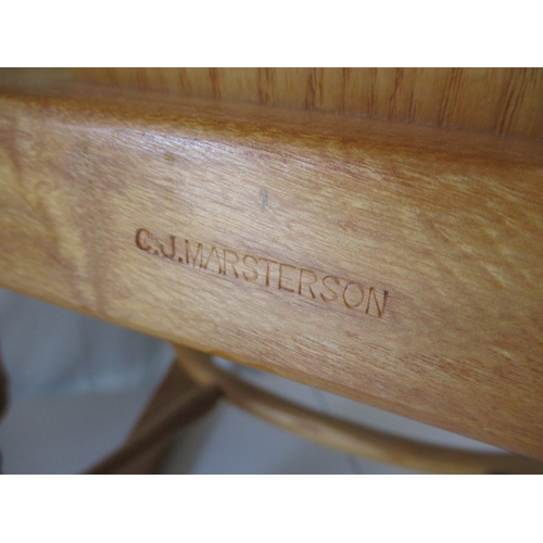 65 - A hardwood rocking chair, makers mark for C J Marsterson in good pre-owned condition