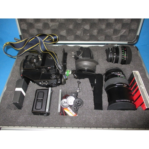 72 - A Bronica ETR Si 120 camera, in hard case with lenses and other accessories, in good used condition,... 