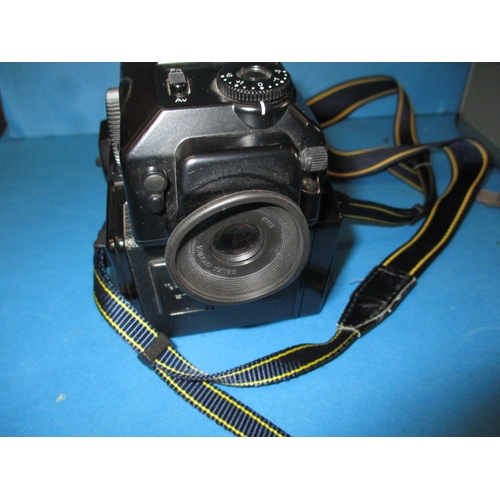 72 - A Bronica ETR Si 120 camera, in hard case with lenses and other accessories, in good used condition,... 