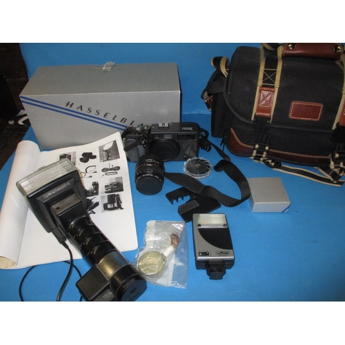 73 - A Hasselblad XPan camera, in soft kit bag with accessories, in good used condition, not tested as to... 