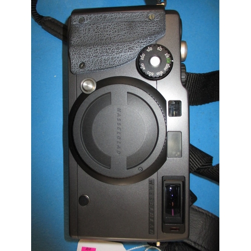 73 - A Hasselblad XPan camera, in soft kit bag with accessories, in good used condition, not tested as to... 