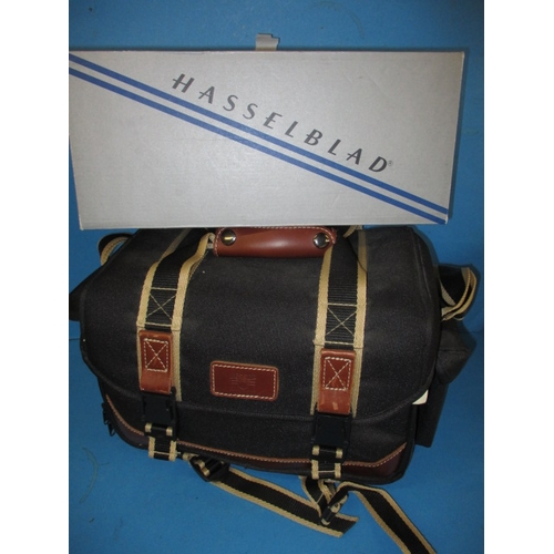 73 - A Hasselblad XPan camera, in soft kit bag with accessories, in good used condition, not tested as to... 