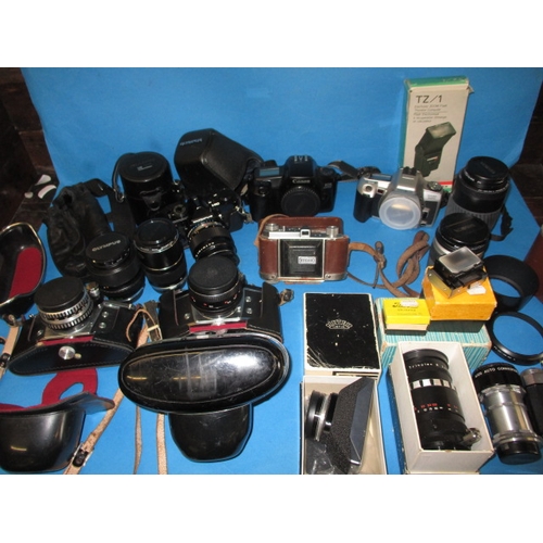 74 - A large quantity of vintage cameras and accessories, various makers and ages, none tested as to func... 