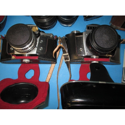 74 - A large quantity of vintage cameras and accessories, various makers and ages, none tested as to func... 