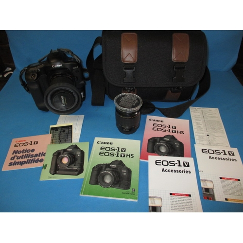 75 - A Canon EOS1 camera, with kit bag, paperwork and a lens, in used condition and not tested as to func... 