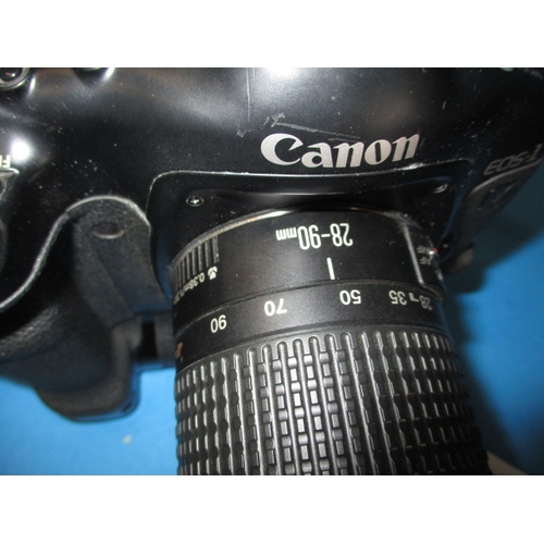 75 - A Canon EOS1 camera, with kit bag, paperwork and a lens, in used condition and not tested as to func... 