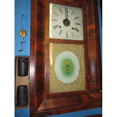 82 - A vintage Ansonia wall clock, with pendulum, weights and key, not tested as to function