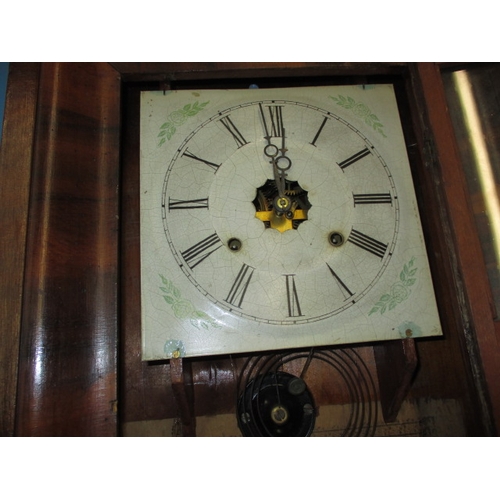 82 - A vintage Ansonia wall clock, with pendulum, weights and key, not tested as to function