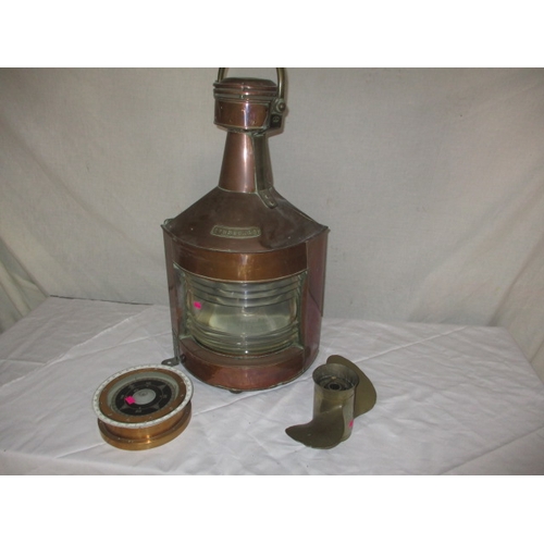 109 - A vintage copper starboard ship’s lamp, ships compass and bronze propeller. All in used condition