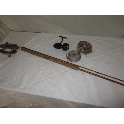 111 - A vintage fly fishing cane rod and 4 reels. Rod by ‘Capella de Luxe’. In used condition with age rel... 