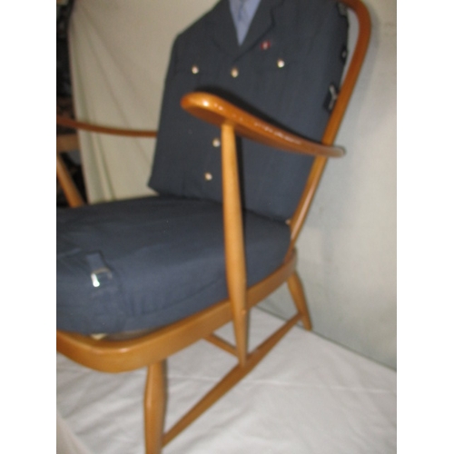 112 - A mid 20th Century elm chair with bespoke upholstery made from a RAF tunic. In good useable pre-owne... 