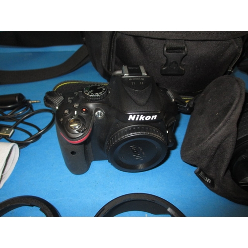 113 - A pre-owned Nikon D5200 camera with 2 lenses, in current working order with charger, leads and kit b... 