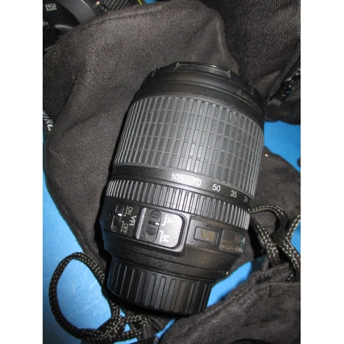 113 - A pre-owned Nikon D5200 camera with 2 lenses, in current working order with charger, leads and kit b... 