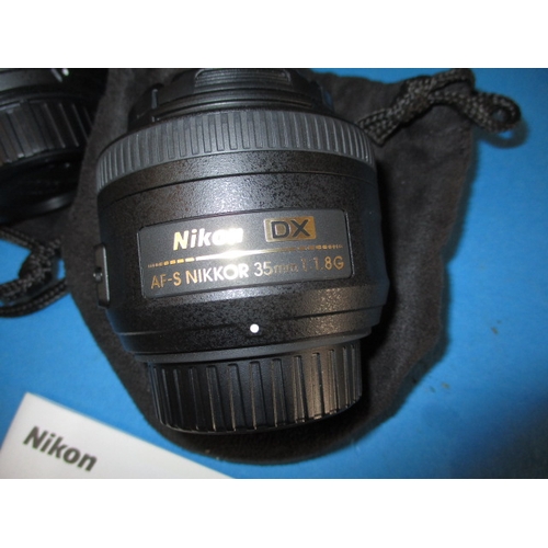 113 - A pre-owned Nikon D5200 camera with 2 lenses, in current working order with charger, leads and kit b... 