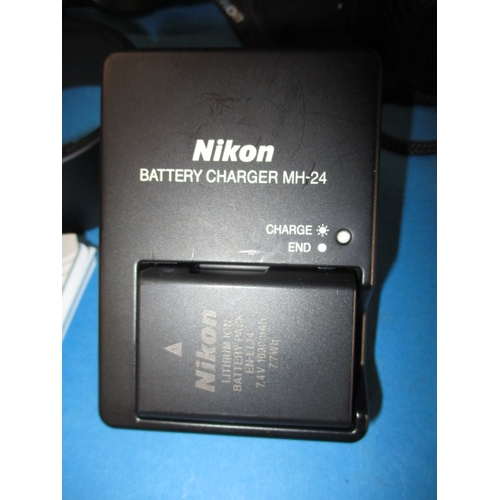 113 - A pre-owned Nikon D5200 camera with 2 lenses, in current working order with charger, leads and kit b... 