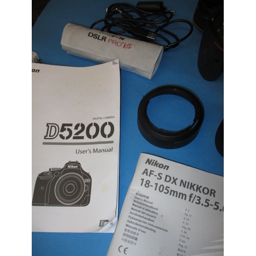 113 - A pre-owned Nikon D5200 camera with 2 lenses, in current working order with charger, leads and kit b... 