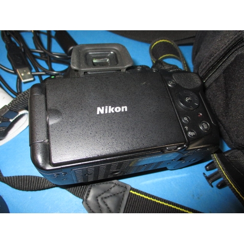 113 - A pre-owned Nikon D5200 camera with 2 lenses, in current working order with charger, leads and kit b... 