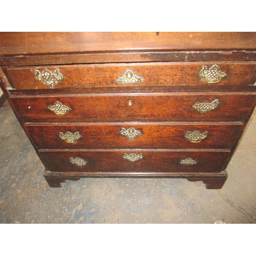 116 - An antique oak bureau with manual loapers and 4 long graduated drawers. Age related marks and repair... 