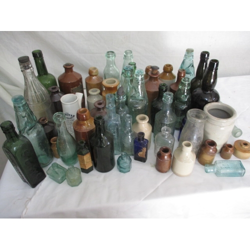A quantity of vintage stoneware and glass bottles, to include poison examples. All in used condition with use related marks