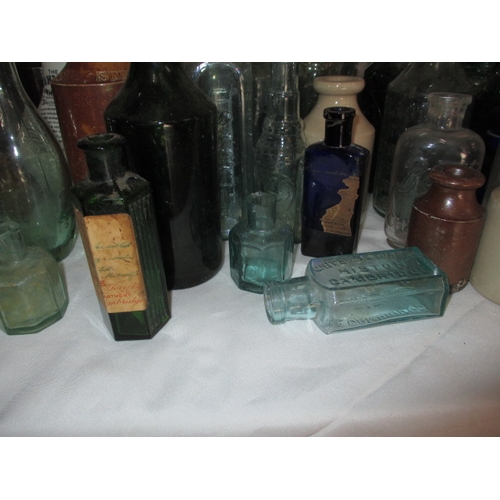 118 - A quantity of vintage stoneware and glass bottles, to include poison examples. All in used condition... 