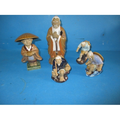 A quantity of Oriental ceramic figures, various sizes, two look to be missing rods but no observed chips or damage