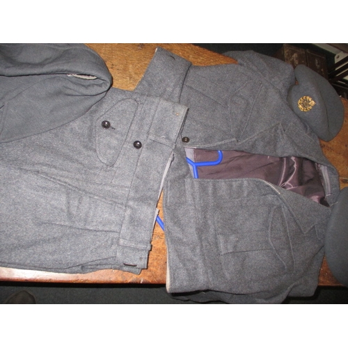 A post war RAF observer corps tunic with airman’s rainproof coat and caps, all in used condition