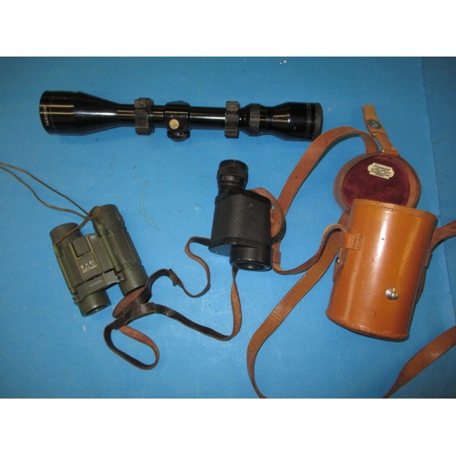 216 - Three field sport optical devices, to include a Tasco scope and a leather cased monocular, all in us... 