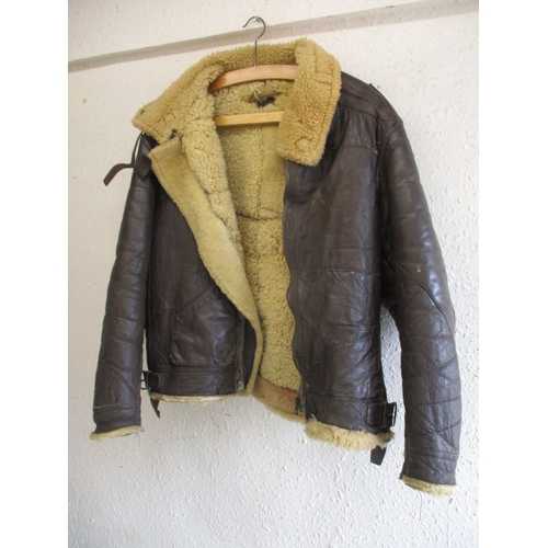 219 - An American type B-3 flying jacket, a little stiff to the leather and with general use-related marks