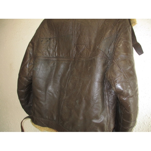 219 - An American type B-3 flying jacket, a little stiff to the leather and with general use-related marks