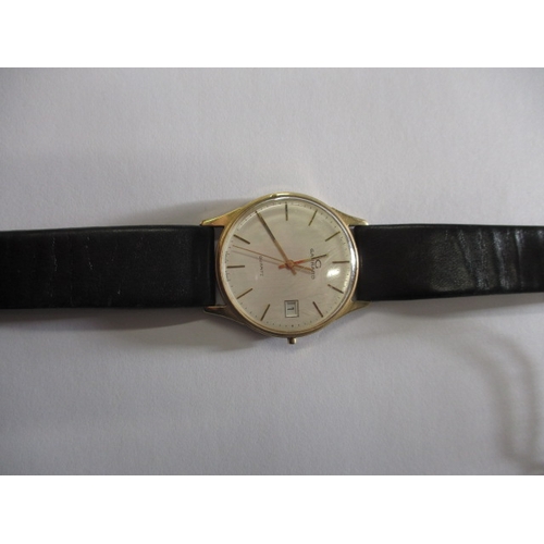 74 - A 1980s gold cased quartz watch with Garrard retailers to dial, dedication to back of case, crown mi... 