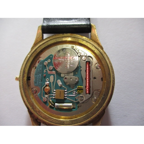 74 - A 1980s gold cased quartz watch with Garrard retailers to dial, dedication to back of case, crown mi... 