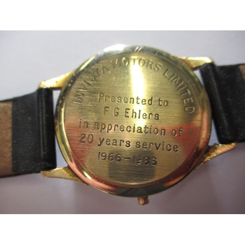 74 - A 1980s gold cased quartz watch with Garrard retailers to dial, dedication to back of case, crown mi... 