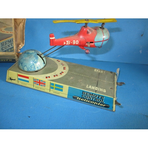 240 - A 1950s Hans Biller clockwork tin-plate toy helicopter, with box, box damaged, main motor and elevat... 