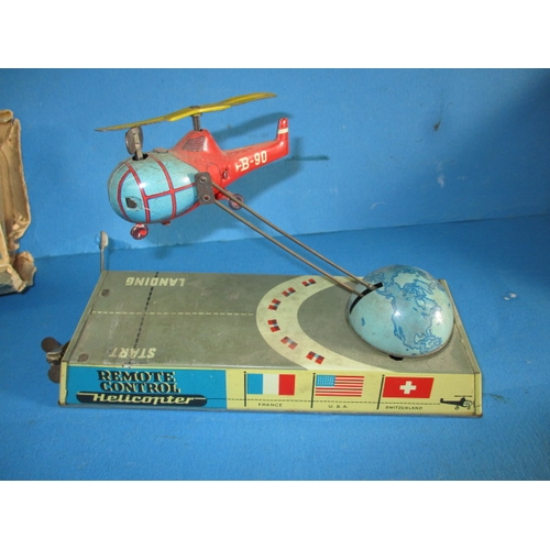 240 - A 1950s Hans Biller clockwork tin-plate toy helicopter, with box, box damaged, main motor and elevat... 