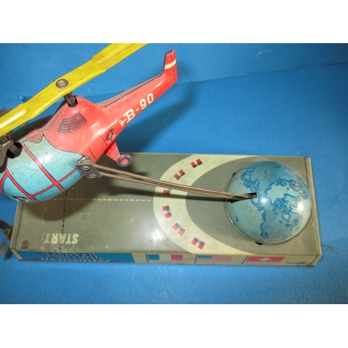 240 - A 1950s Hans Biller clockwork tin-plate toy helicopter, with box, box damaged, main motor and elevat... 