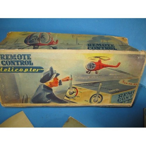 240 - A 1950s Hans Biller clockwork tin-plate toy helicopter, with box, box damaged, main motor and elevat... 