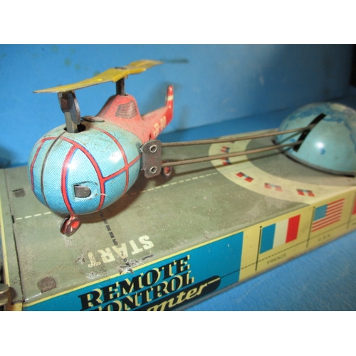 240 - A 1950s Hans Biller clockwork tin-plate toy helicopter, with box, box damaged, main motor and elevat... 