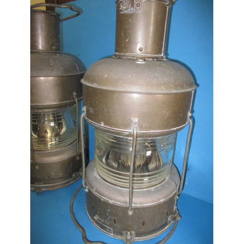 293 - Two genuine ships lanterns, originally on a Chinese factory ship producing cement, each having retai... 