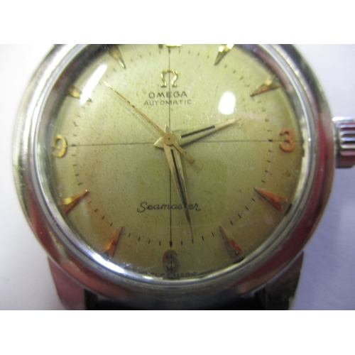 77 - A vintage Omega Seamaster automatic wrist watch, in current working order with use-related marks, no... 