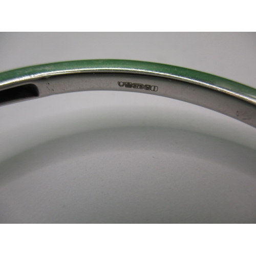 45 - A 9ct yellow and white gold bangle, in good useable pre-owned condition, approx. weight 10.9g