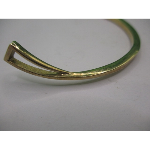 45 - A 9ct yellow and white gold bangle, in good useable pre-owned condition, approx. weight 10.9g