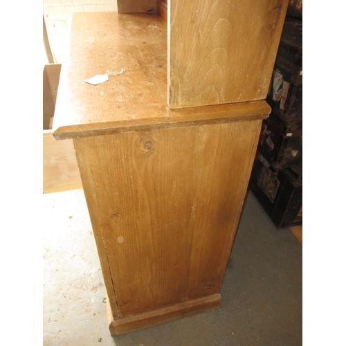 318 - An early 20th Century stripped pine kitchen dresser. In useable, pre-owned condition with age relate... 