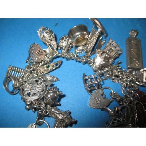 227 - A silver charm bracelet and other silver items, approx. parcel weight with out knife 122g all in use... 