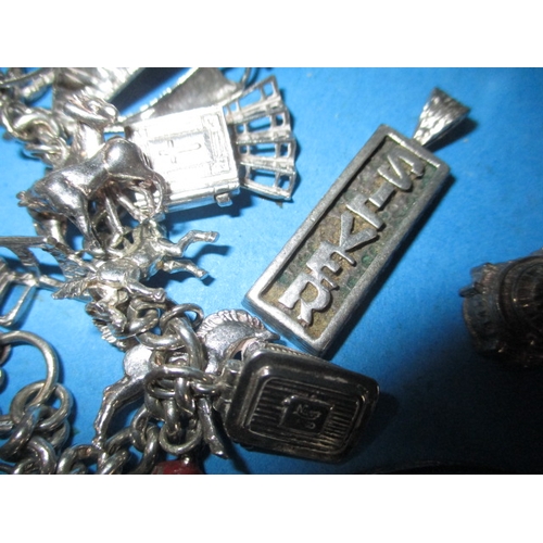 227 - A silver charm bracelet and other silver items, approx. parcel weight with out knife 122g all in use... 