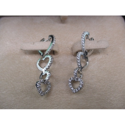 46 - A pair of 18ct white gold and diamond earrings with certificate, approx. 0.74 total diamond weight, ... 