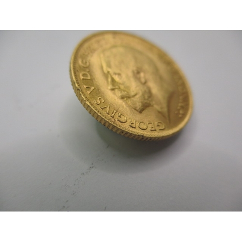 96 - A George V gold half sovereign dated 1913, a circulated coin with very fine definition of features