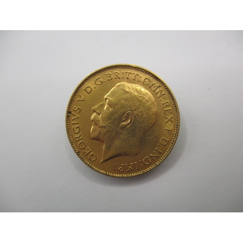 97 - A George V gold half sovereign dated 1913, a circulated coin with very fine definition of features