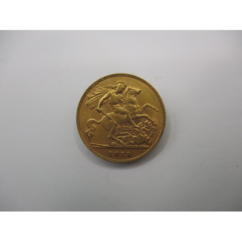 98 - A George V gold half sovereign dated 1913, a circulated coin with very fine definition of features