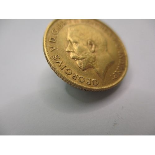 102 - A George V gold half sovereign dated 1911, a circulated coin with very fine definition of features