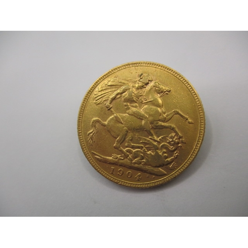 106 - An Edward VII full gold sovereign dated 1904, a circulated coin with fine definition of features